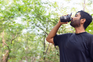 Founder of Single Scoop Nutrition, Varshil Parikh, Drinking Single Scoop Nutrition out of a black shaker.
